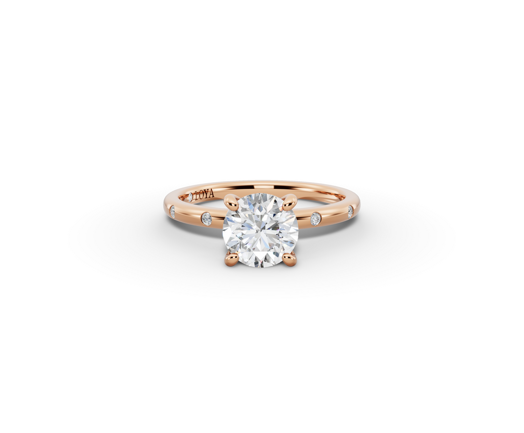 Amor Round Shape Ring in 18K rose gold with diamonds on the band, set with a LOYA diamond (lying view)