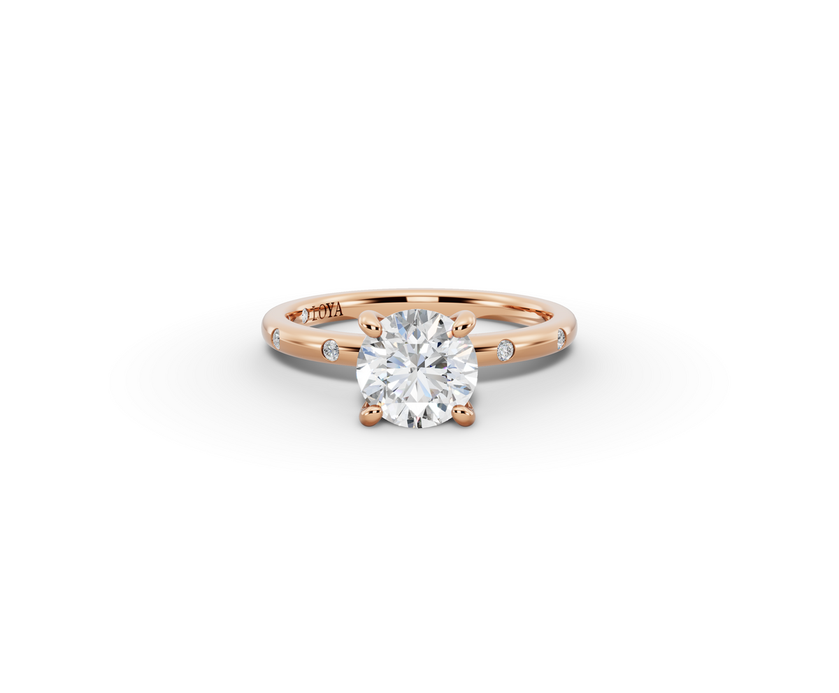 Amor Round Shape Ring in 18K rose gold with diamonds on the band, set with a LOYA diamond (lying view)