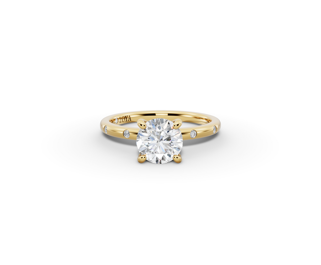 Amor Round Shape Ring in 18K yellow gold with diamonds on the band, set with a LOYA diamond (lying view)