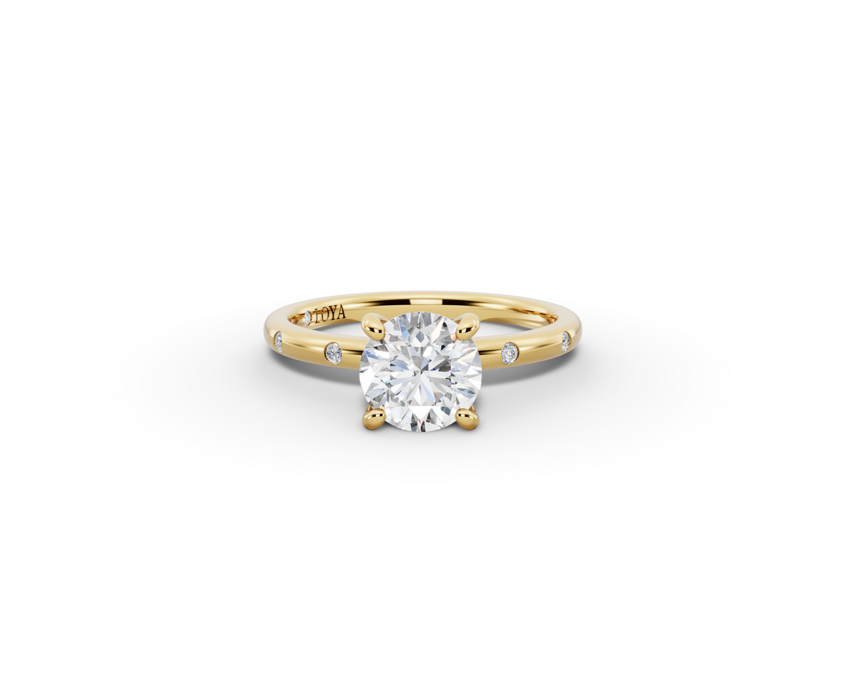 Amor Round Shape Ring in 18K yellow gold with diamonds on the band, set with a LOYA diamond (lying view)