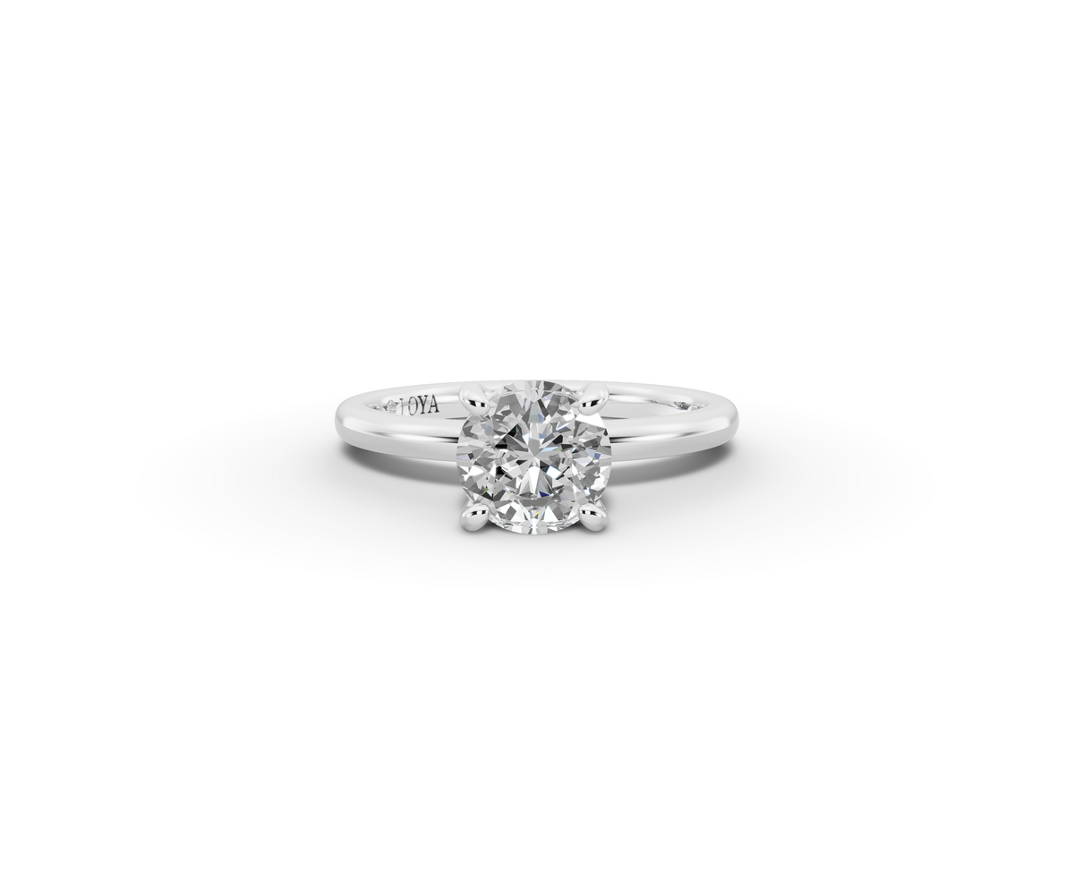Amor Round Shape Ring in 18K white gold with a plain band, set with a LOYA diamond (lying view)