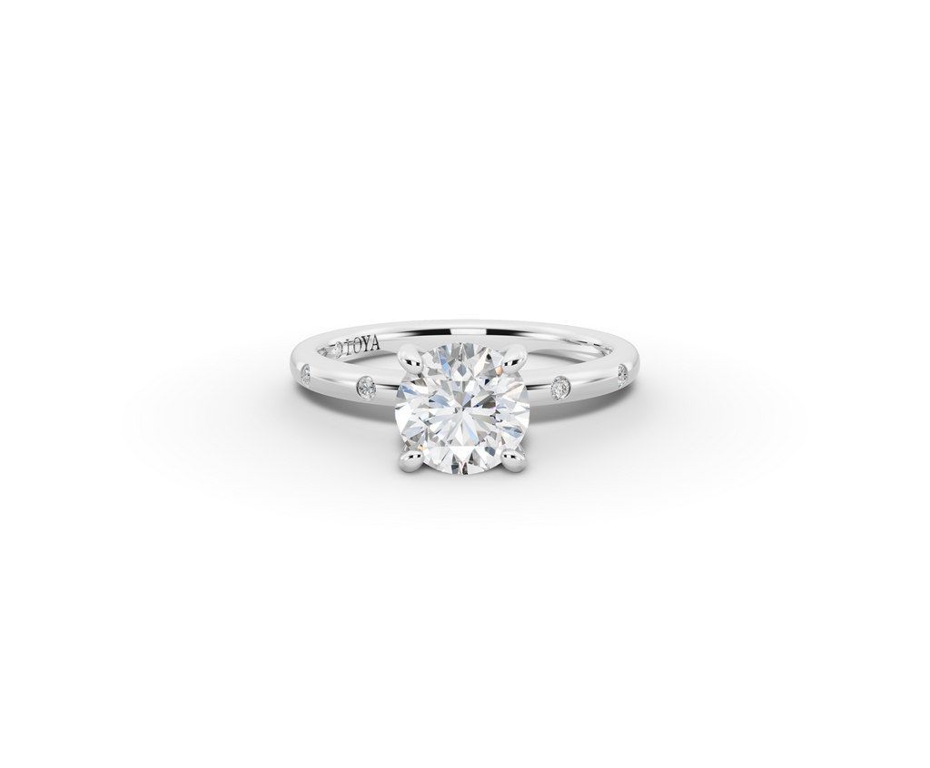 Amor Round Shape Ring in 18K white gold with diamonds on the band, set with a LOYA diamond (lying view)