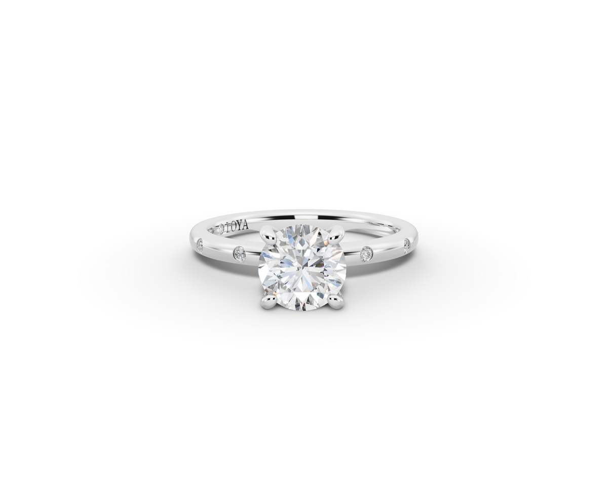 Amor Round Shape Ring in 18K white gold with diamonds on the band, set with a LOYA diamond (lying view)