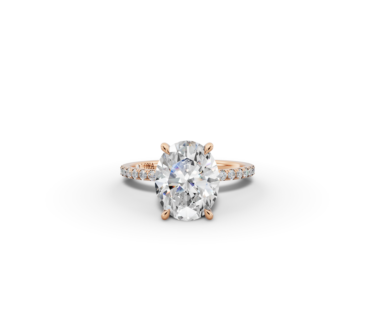 Vita Thin Oval Shape Ring in 18K rose gold with diamonds on the band, set with a LOYA diamond (lying view)