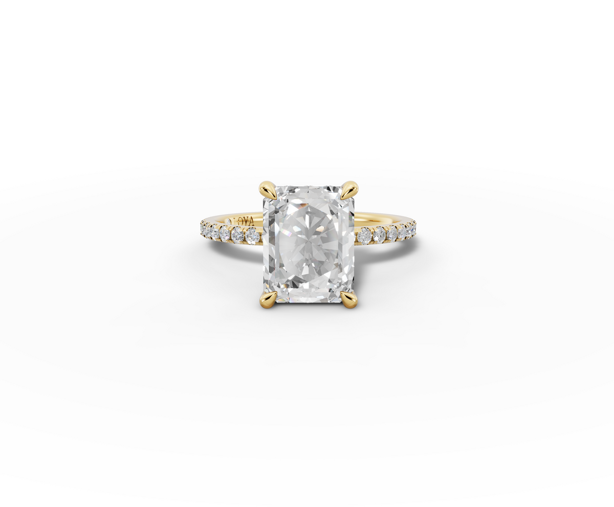Vita Radiant Shape Ring in 18K yellow gold with diamonds on the band, set with a LOYA diamond (lying view)