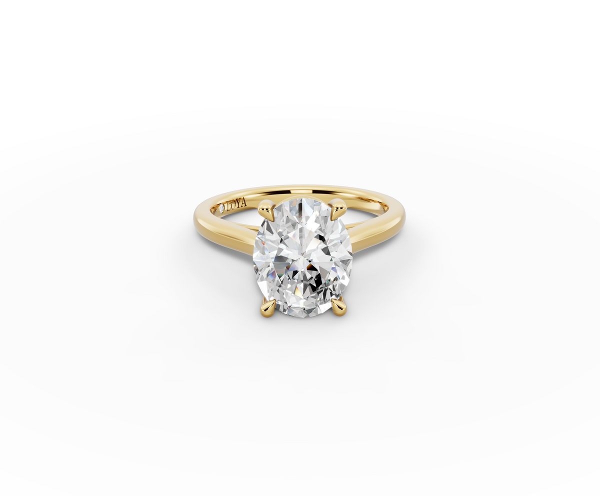 Alba Oval Shape Ring in 18K yellow gold with a plain band, set with a LOYA diamond (lying view)
