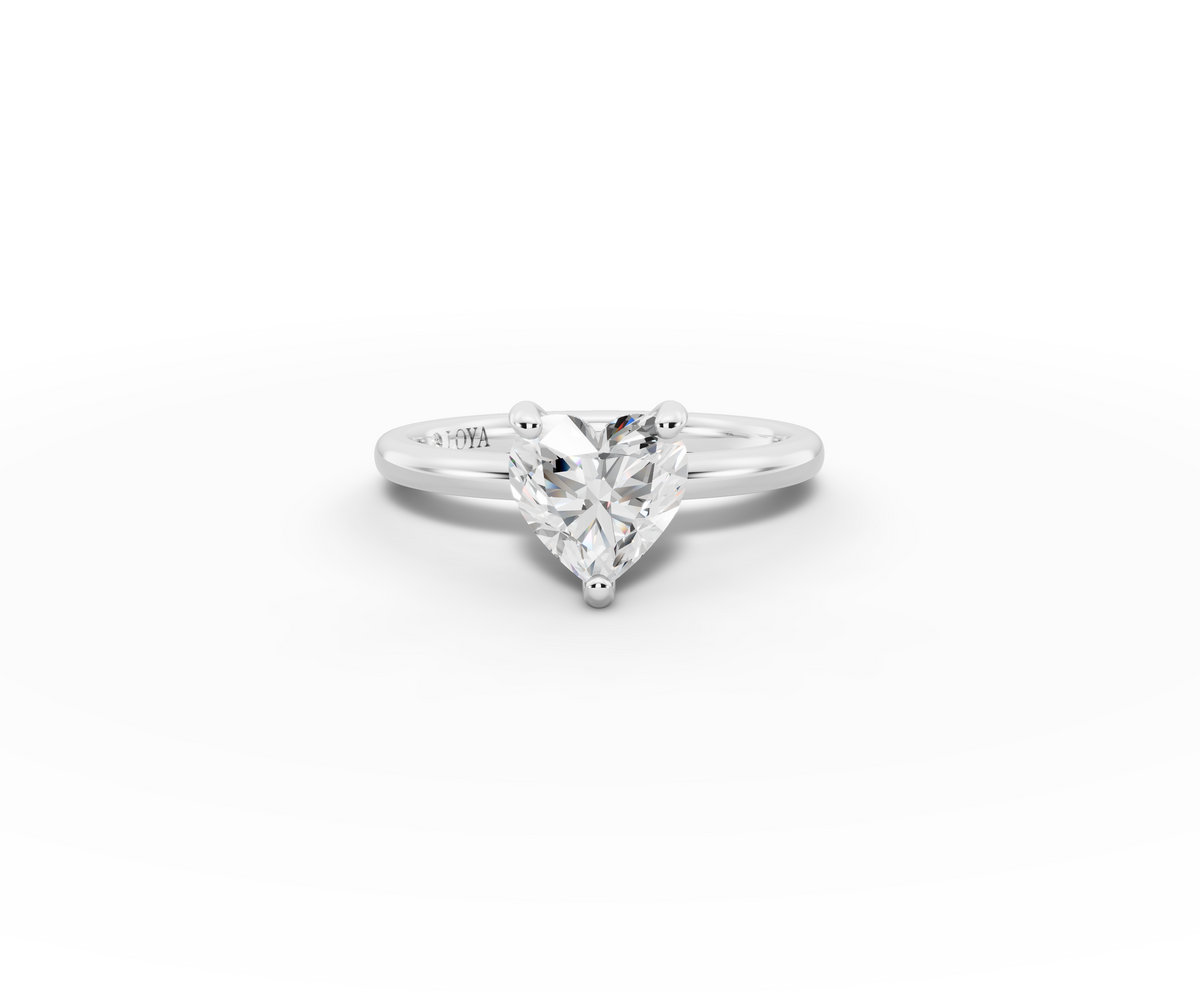 Amor Heart Shape Ring in 18K white gold with a plain band, set with a LOYA diamond (lying view)