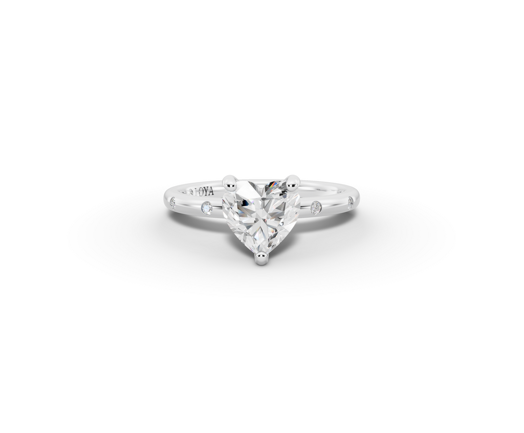 Amor Heart Shape Ring in 18K white gold with diamonds on the band, set with a LOYA diamond (lying view)