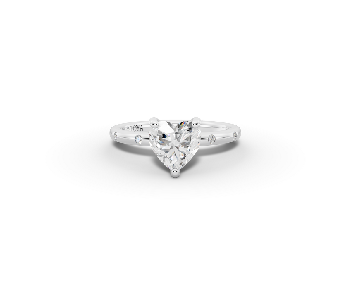 Amor Heart Shape Ring in 18K white gold with diamonds on the band, set with a LOYA diamond (lying view)