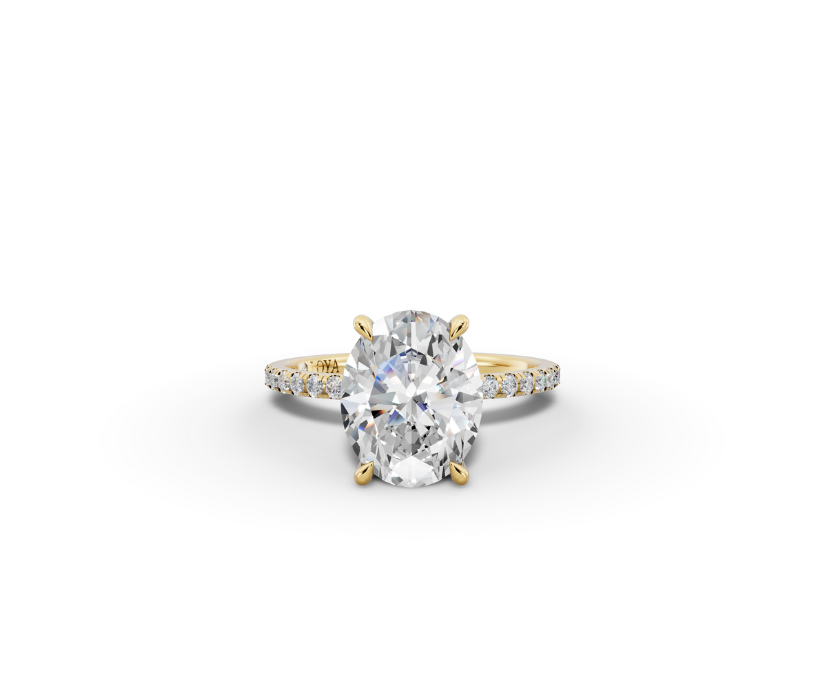 Vita Thin Oval Shape Ring in 18K yellow gold with diamonds on the band, set with a LOYA diamond (lying view)