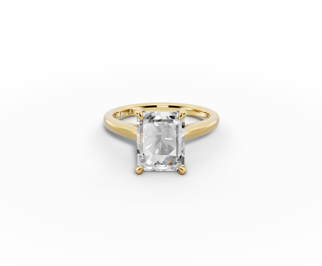 Alba Radiant Shape Ring in 18K yellow gold with a plain band, set with a LOYA diamond (lying view)