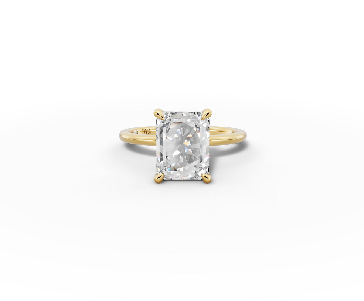 Vita Radiant Shape Ring in 18K yellow gold with a plain band, set with a LOYA diamond (lying view)