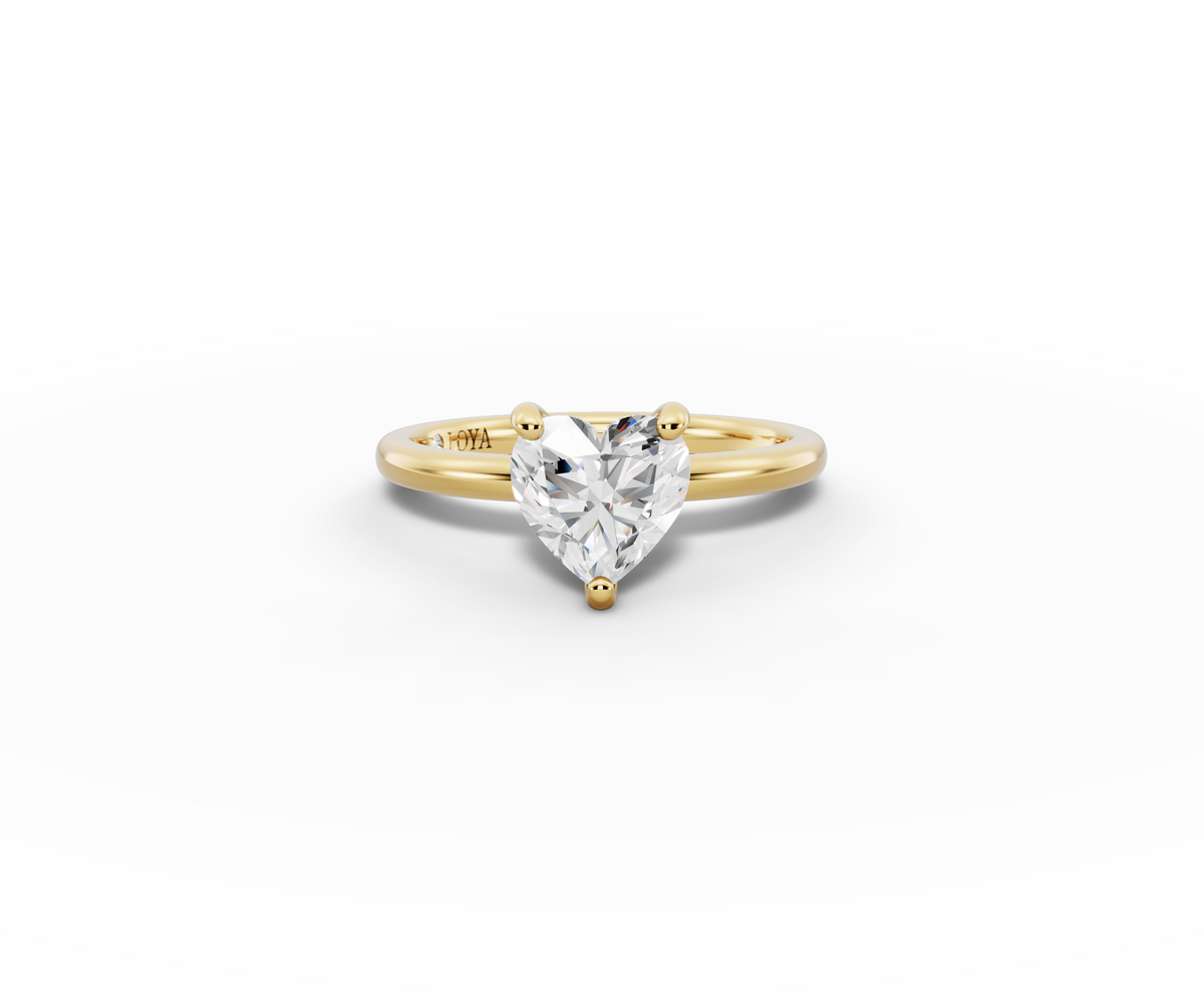 Amor Heart Shape Ring in 18K yellow gold with a plain band, set with a LOYA diamond (lying view)