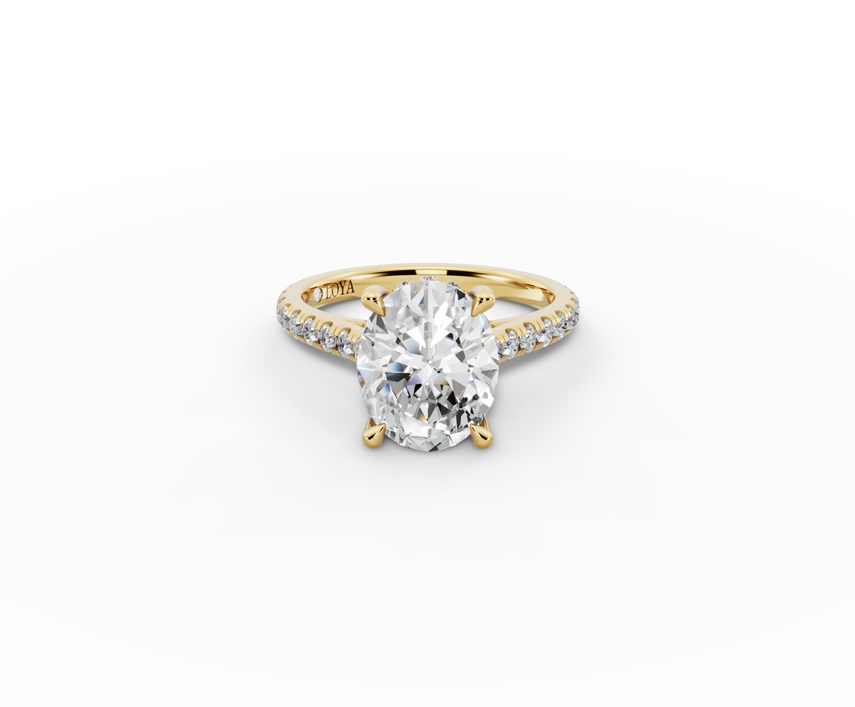 Alba Oval Shape Ring in 18K yellow gold with diamonds on the band, set with a LOYA diamond (lying view)