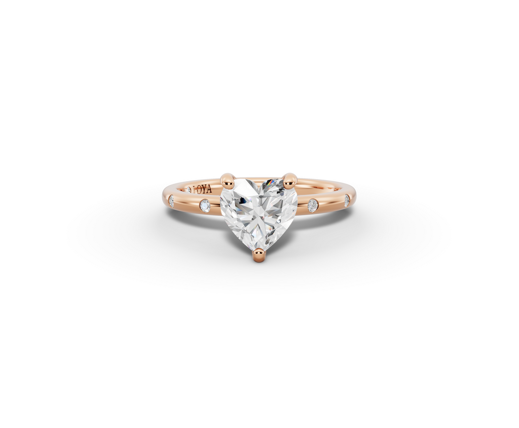 Amor Heart Shape Ring in 18K rose gold with diamonds on the band, set with a LOYA diamond (lying view)