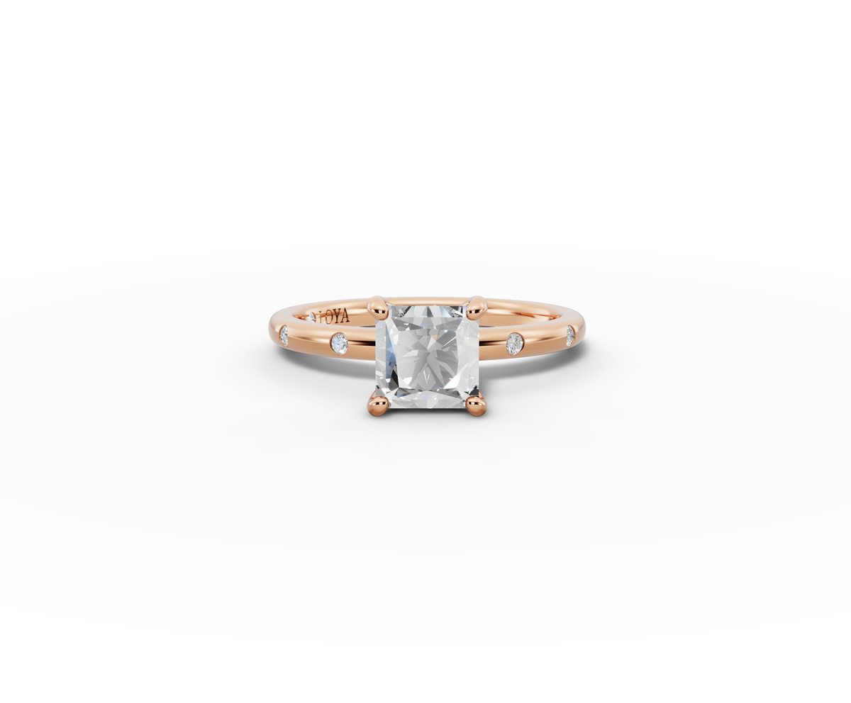 Amor Princess Shape Ring in 18K rose gold with diamonds on the band, set with a LOYA diamond (lying view)
