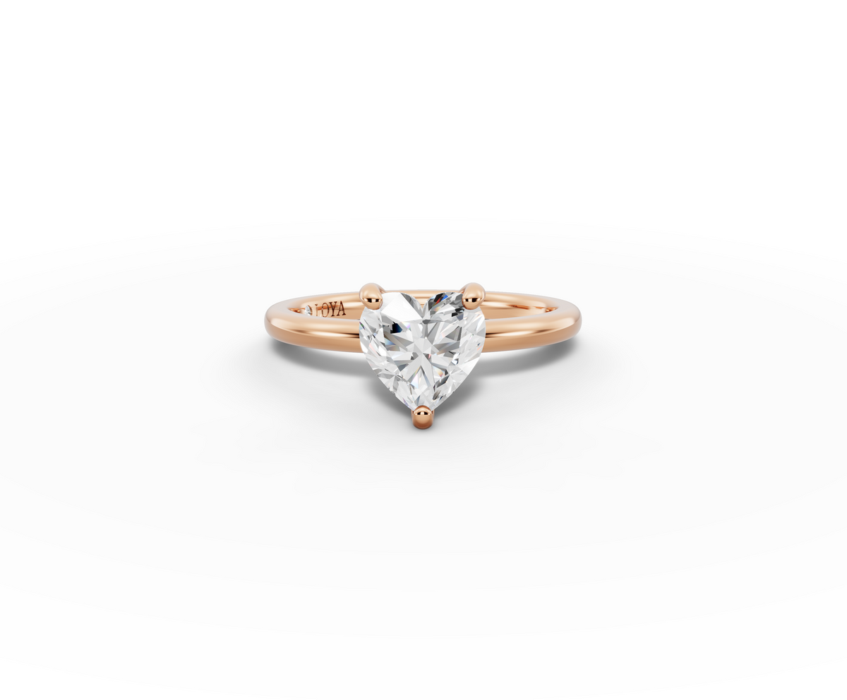 Amor Heart Shape Ring in 18K rose gold with a plain band, set with a LOYA diamond (lying view)