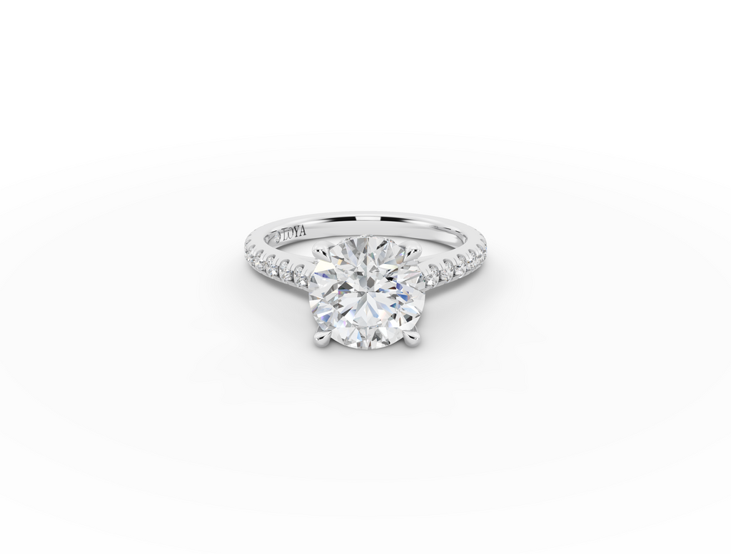 Alba Round Shape Ring in 18K white gold with diamonds on the band, set with a LOYA diamond (lying view)