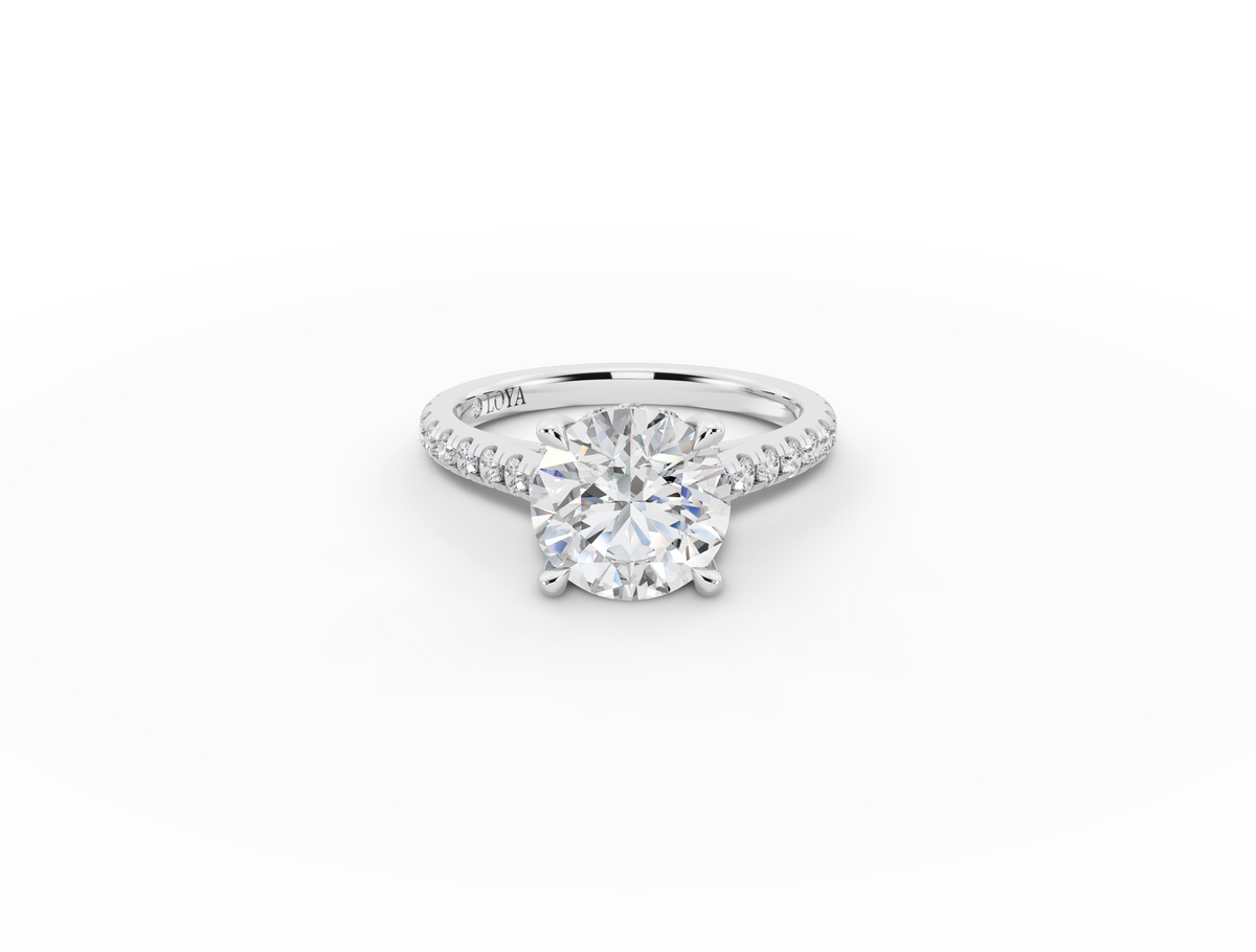 Alba Round Shape Ring in 18K white gold with diamonds on the band, set with a LOYA diamond (lying view)