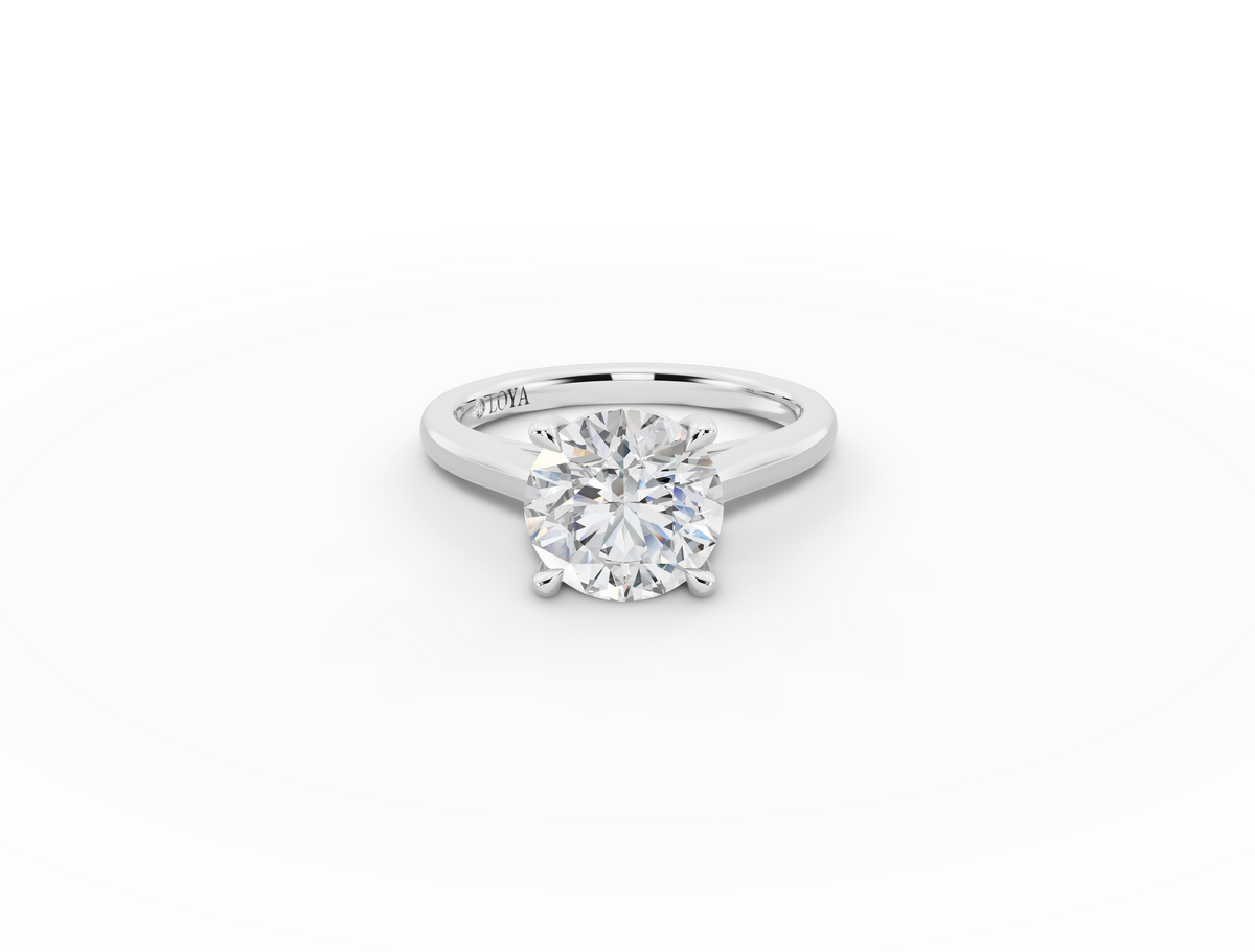 Alba Round Shape Ring in 18K white gold with a plain band, set with a LOYA diamond (lying view)