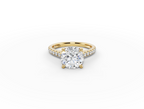 Alba Round Shape Ring in 18K yellow gold with diamonds on the band, set with a LOYA diamond (lying view)