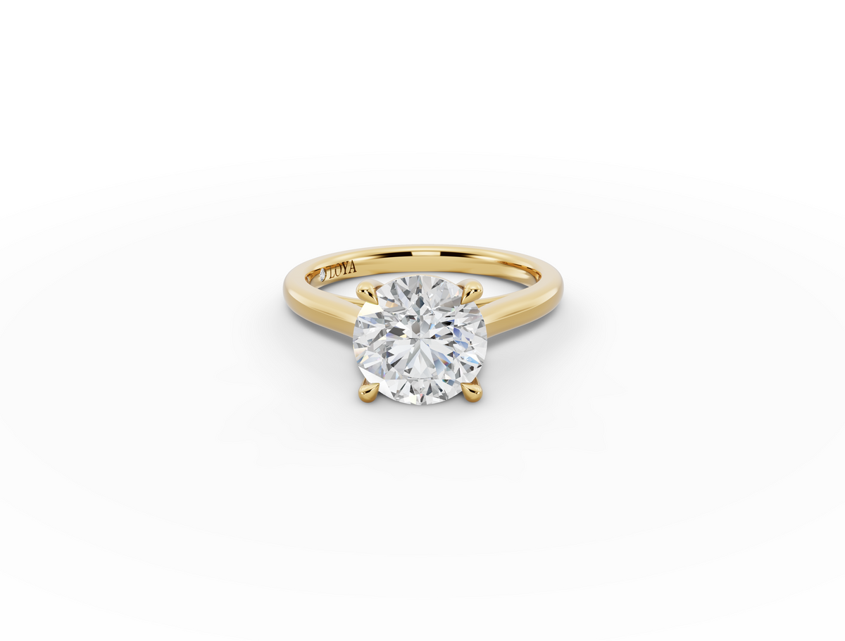 Alba Round Shape Ring in 18K yellow gold with a plain band, set with a LOYA diamond (lying view)