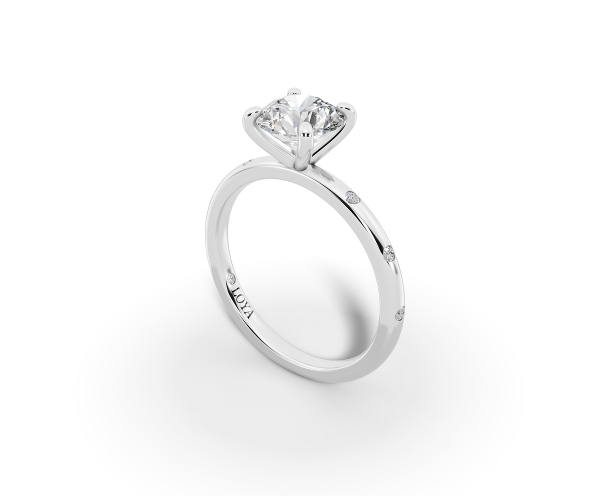 Amor Round Shape Ring in 18K white gold with diamonds on the band, set with a LOYA diamond (perspective view)