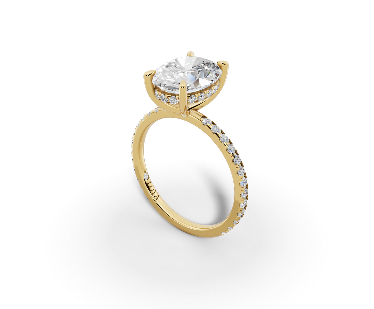 Vita Thin Oval Shape Ring in 18K yellow gold with diamonds on the band, set with a LOYA diamond (perspective view)