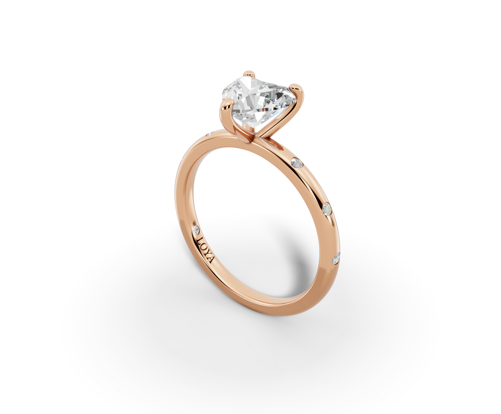 Amor Heart Shape Ring in 18K rose gold with diamonds on the band, set with a LOYA diamond (perspective view)