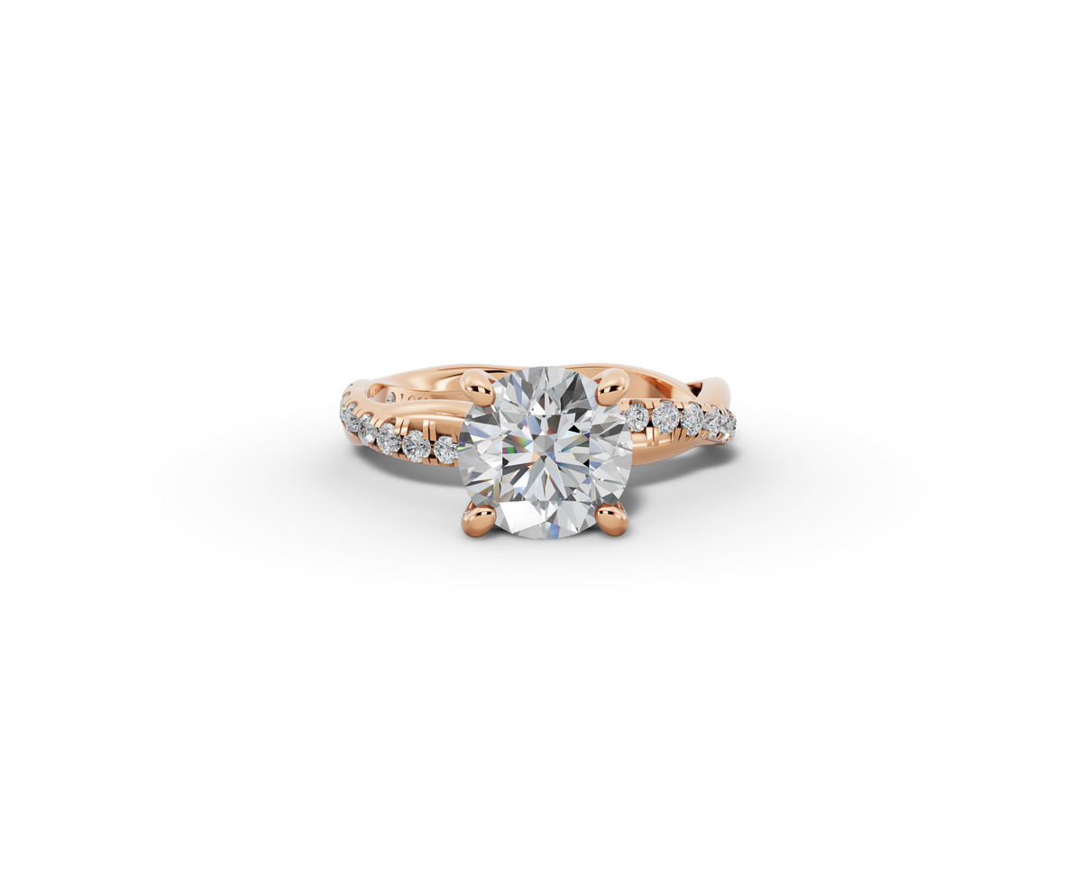 Mira Round Shape Ring in 18K rose gold with diamonds on the band, set with a LOYA diamond (lying view)