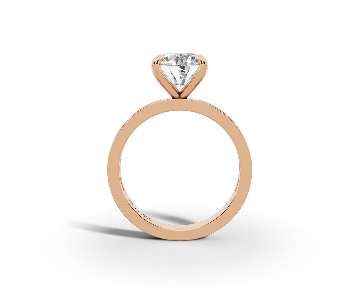 Nova Round Shape Ring in 18K rose gold with diamonds on the band, set with a LOYA diamond (side view)