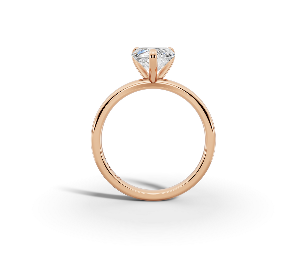 Amor Heart Shape Ring in 18K rose gold with a plain band, set with a LOYA diamond (side view)