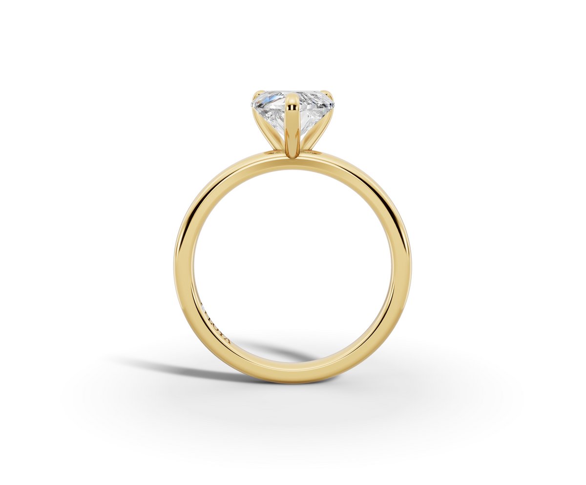 Amor Heart Shape Ring in 18K yellow gold with a plain band, set with a LOYA diamond (side view)