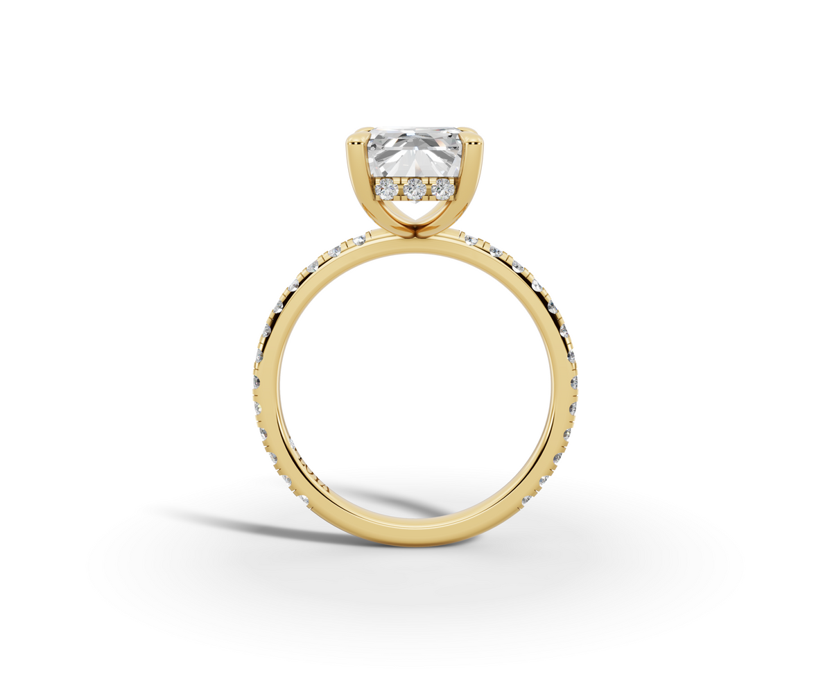 Vita Radiant Shape Ring in 18K yellow gold with diamonds on the band, set with a LOYA diamond (side view)