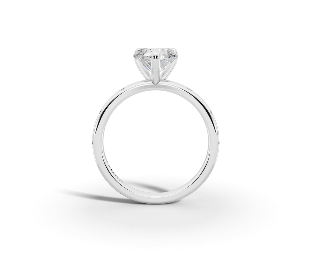 Amor Heart Shape Ring in 18K white gold with diamonds on the band, set with a LOYA diamond (side view)